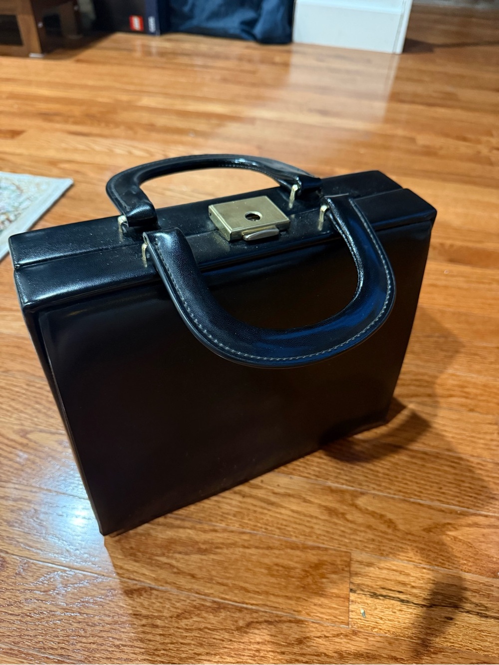 Bon voyage Black Top-Handle Satchel with Gold Lock